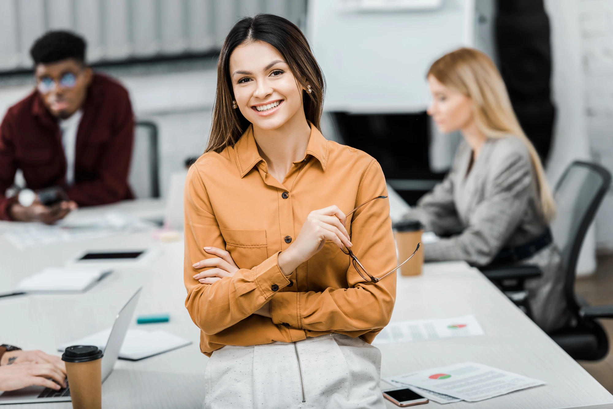 business woman smiling in meeting cosmetic dentists in Arlington