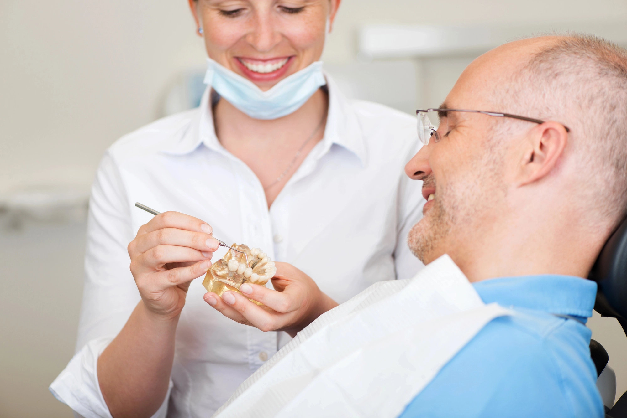 dentist and patient talking about dental implants in McLean