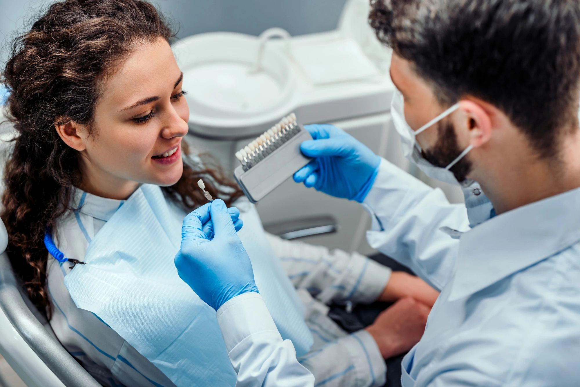 patient and TMJ dentist in McLean discussing veneers