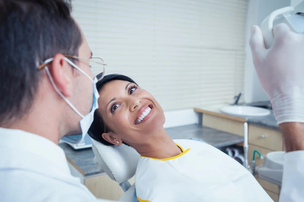 relaxed woman looking at her dentist after receiving sedation dentistry in Arlington