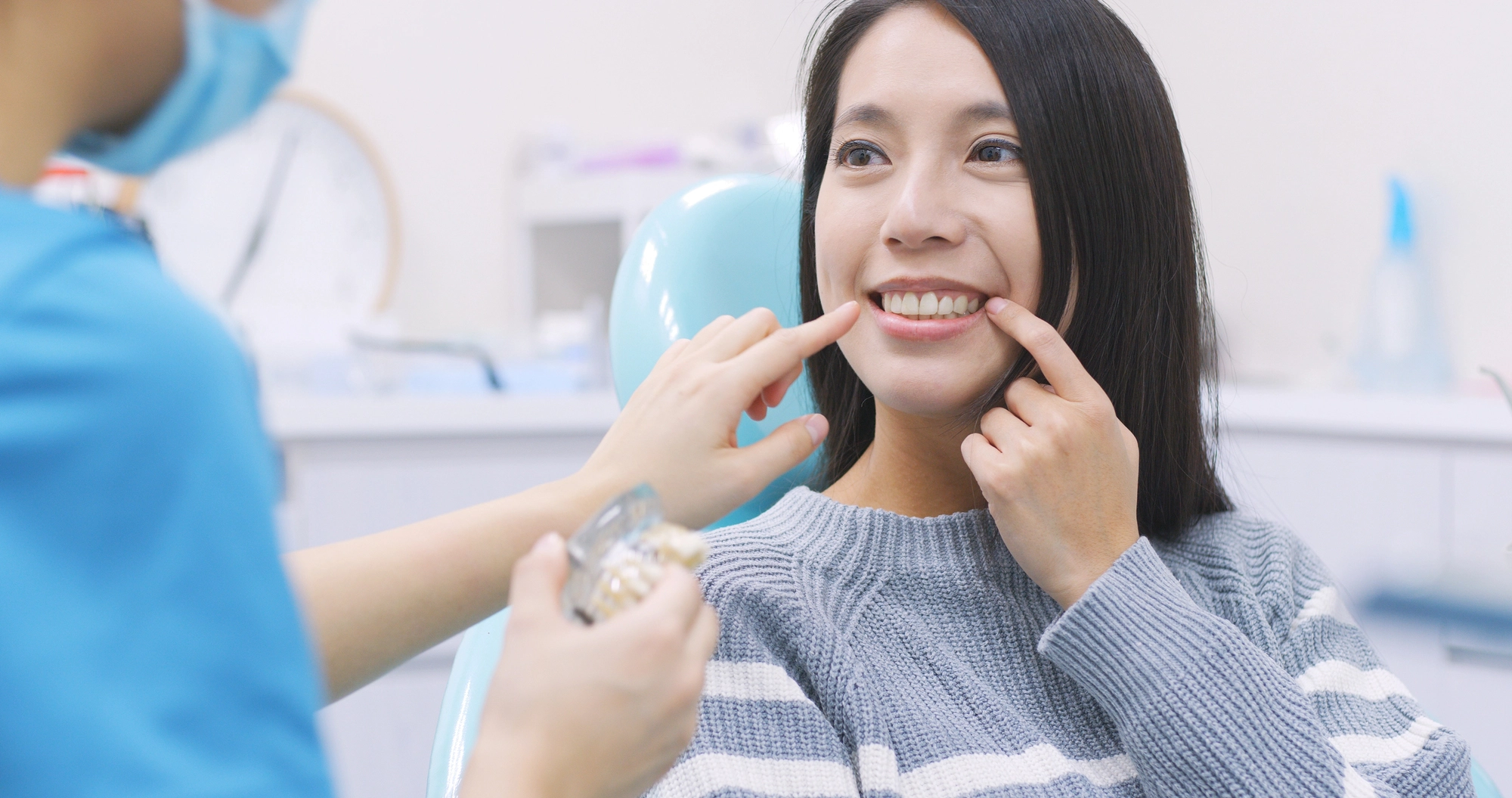 woman at the dentist discussing dental implants in McLean with her dentist