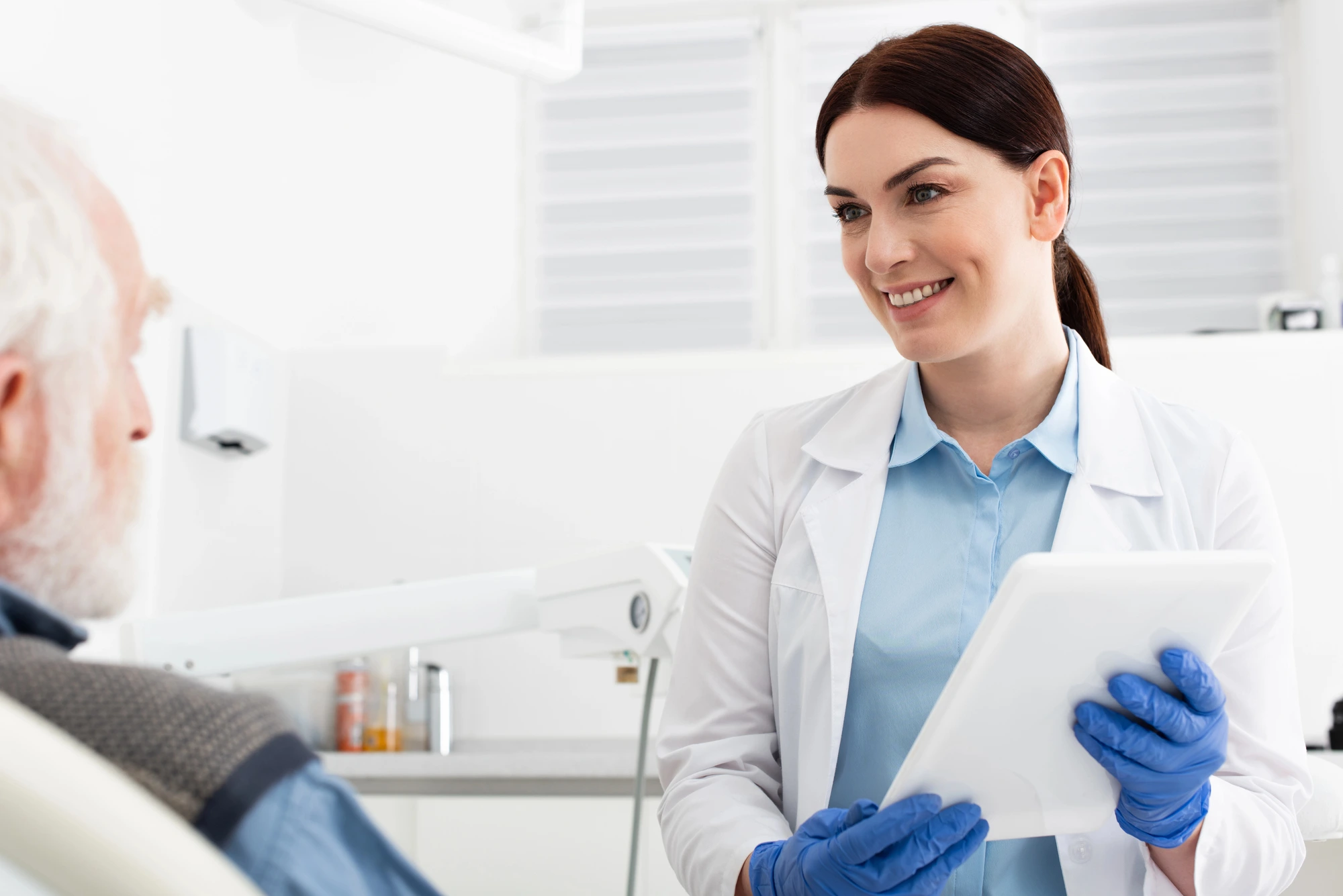 dentist explaing the latest dental technology to patient