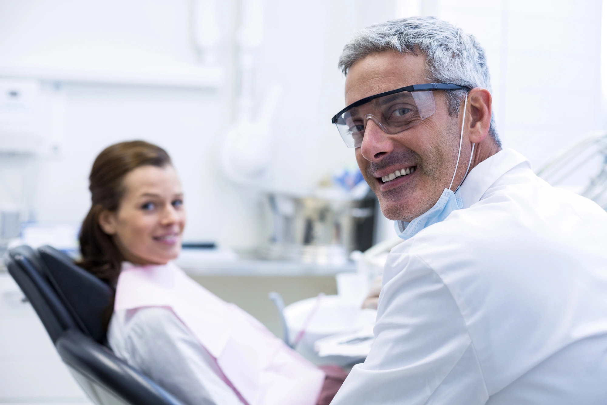 dentist and patient talking about dental implants near me
