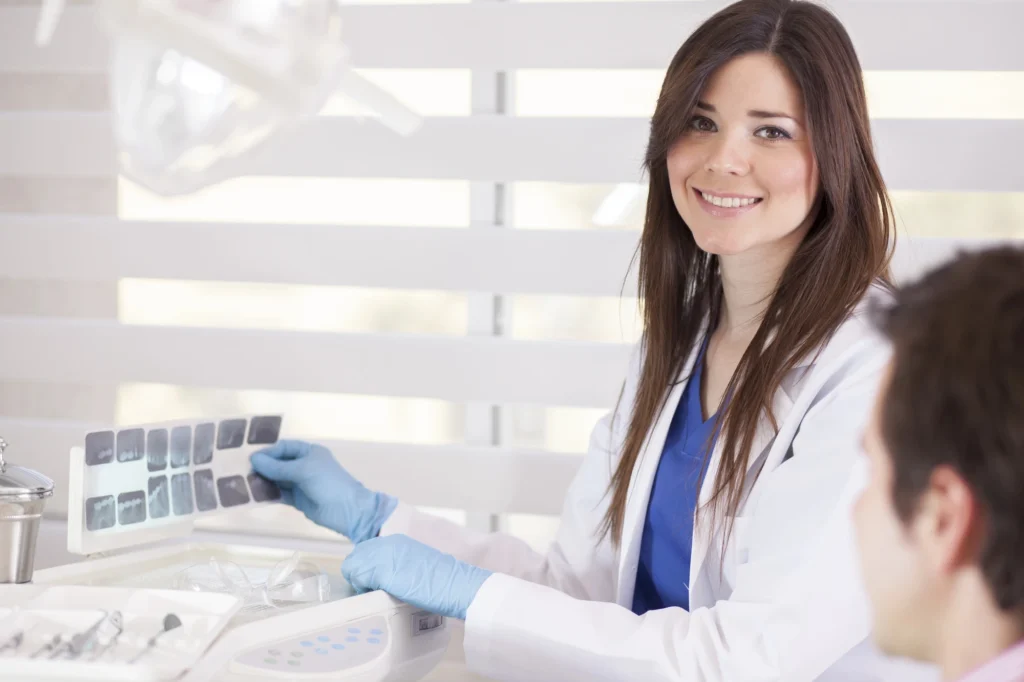 Dentist telling patient about affordable dental crowns in McLean