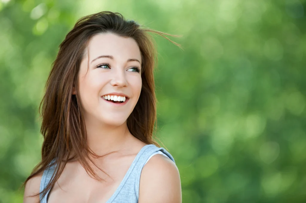 happy woman getting affordable dental crowns in McLean