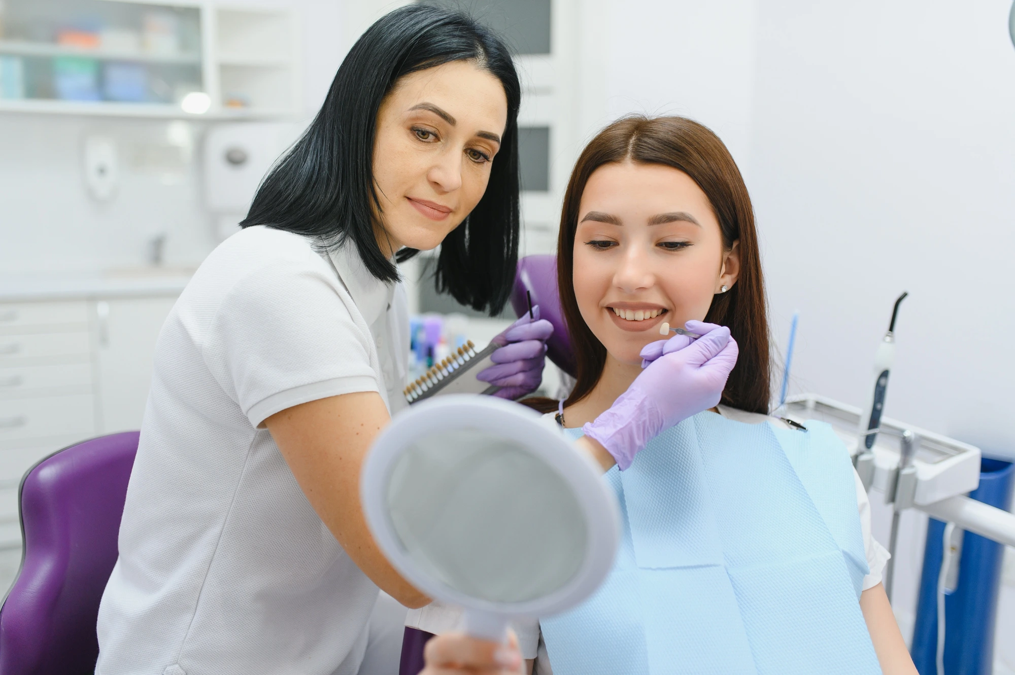 happy woman talking to cosmetic dentists in Arlington